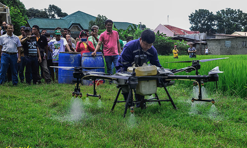 Farmers learn drone spraying technology in corporate farming
